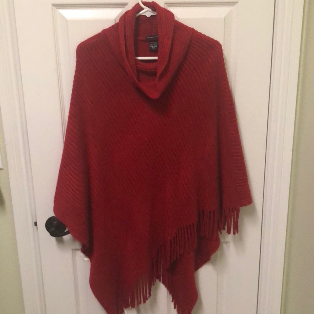 Red poncho with fringe